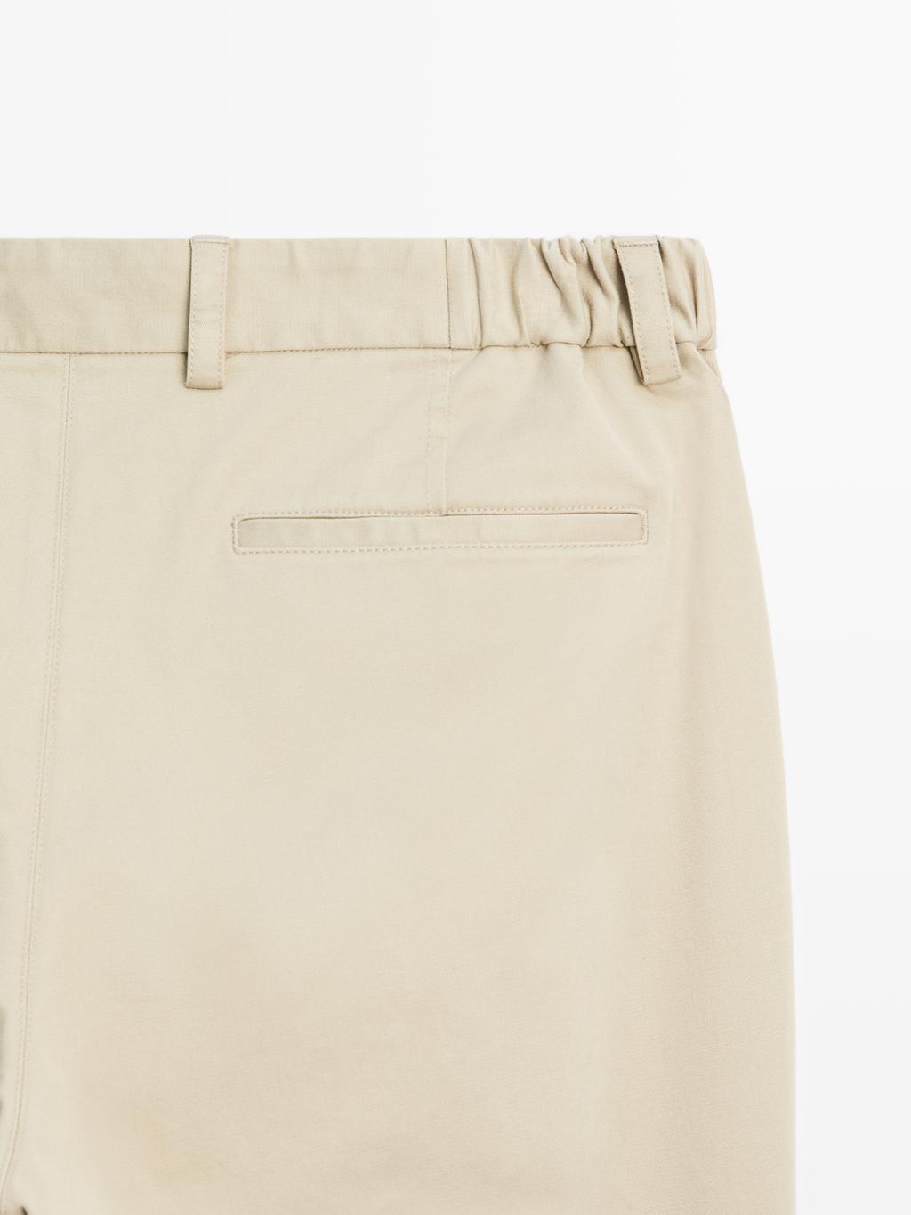 Slim fit trousers with elastic side detail