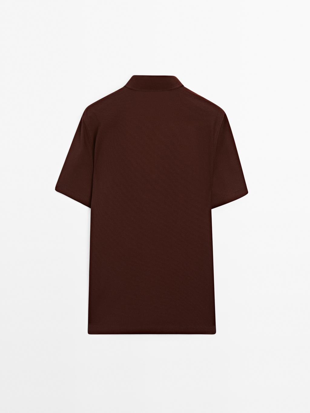 Textured polo shirt with hidden button