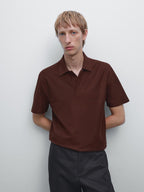 Textured polo shirt with hidden button
