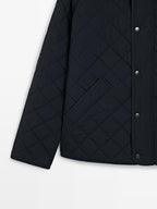 Quilted jacket with corduroy collar