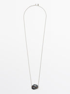 Necklace with ceramic pendant