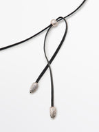 Necklace with fossil piece pendant