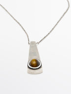 Geometric pendant with stone