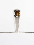 Geometric pendant with stone