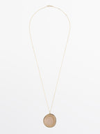 Necklace with translucent stone pendant