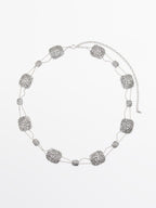 Textured medallion chain belt