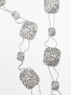 Textured medallion chain belt