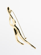 Abstract metal brooch