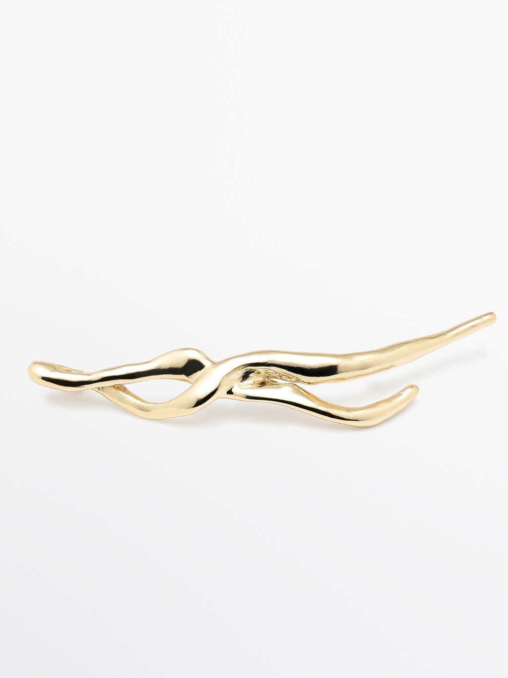 Abstract metal brooch