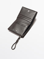 Animal print hair on leather wallet