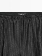 Darted pinstripe trousers