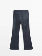 Waxed flare fit trousers