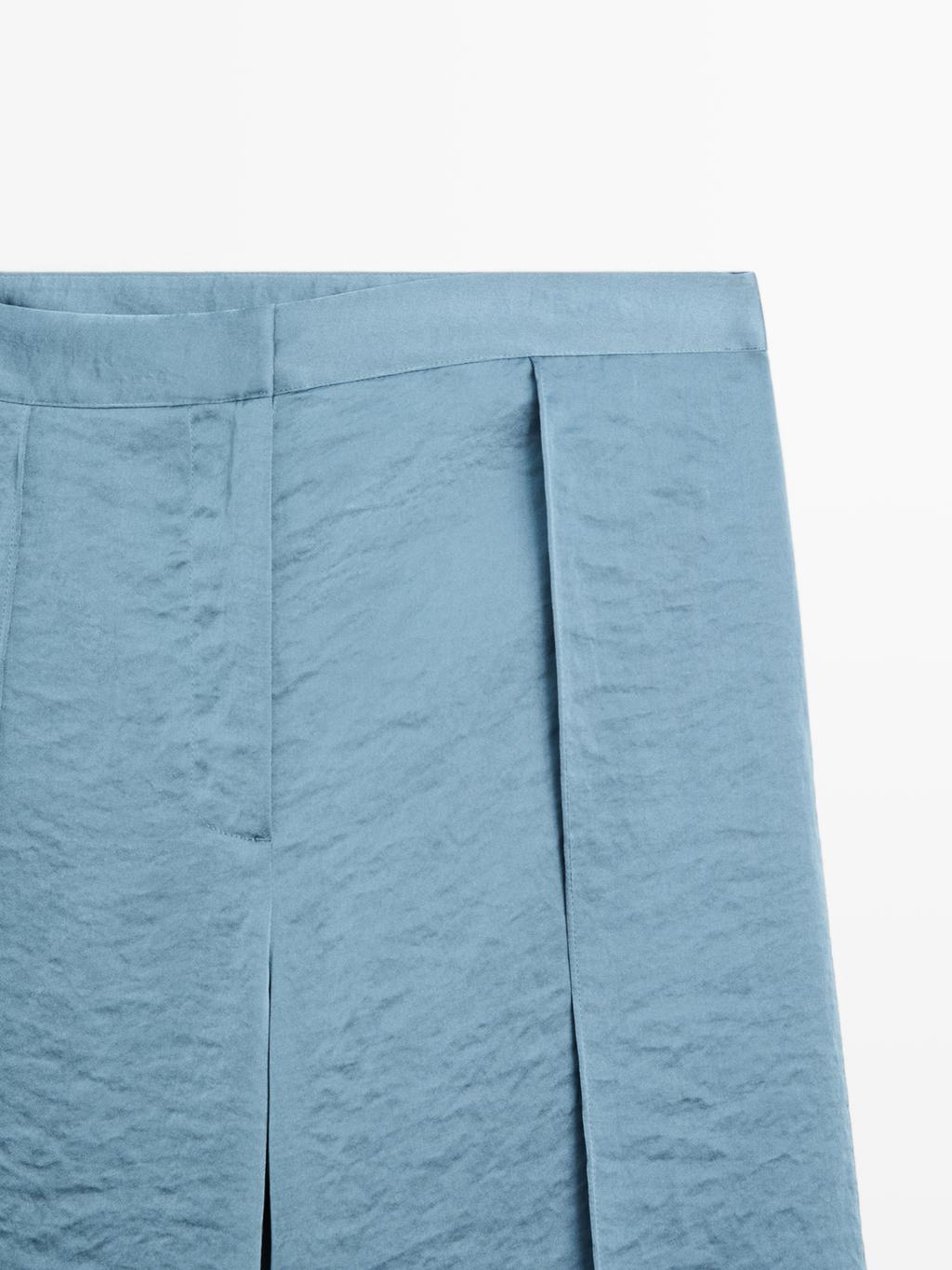 Flowing palazzo trousers with slits