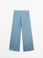 Flowing palazzo trousers with slits