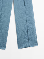 Flowing palazzo trousers with slits