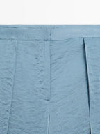 Flowing palazzo trousers with slits