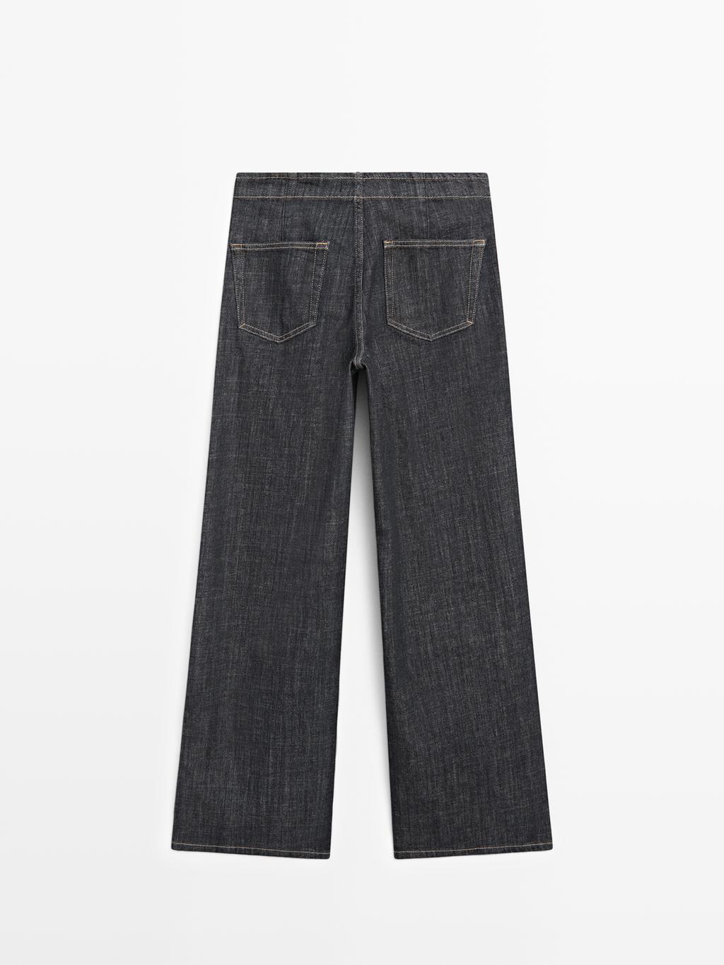 High-waist wide-leg jeans with chains