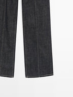 High-waist wide-leg jeans with chains