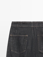 High-waist wide-leg jeans with chains