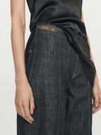 High-waist wide-leg jeans with chains