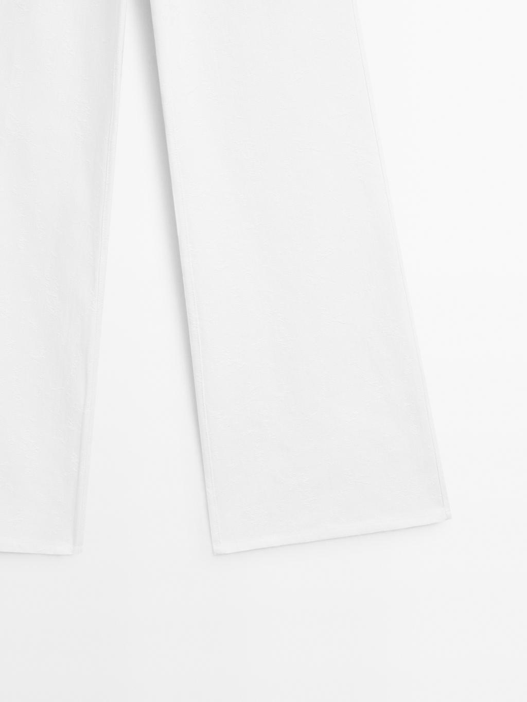 Textured wide-leg denim-effect trousers