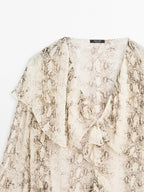 Snakeskin print blouse with ruffles