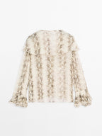 Snakeskin print blouse with ruffles