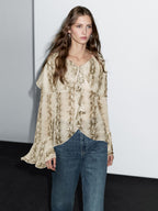 Snakeskin print blouse with ruffles