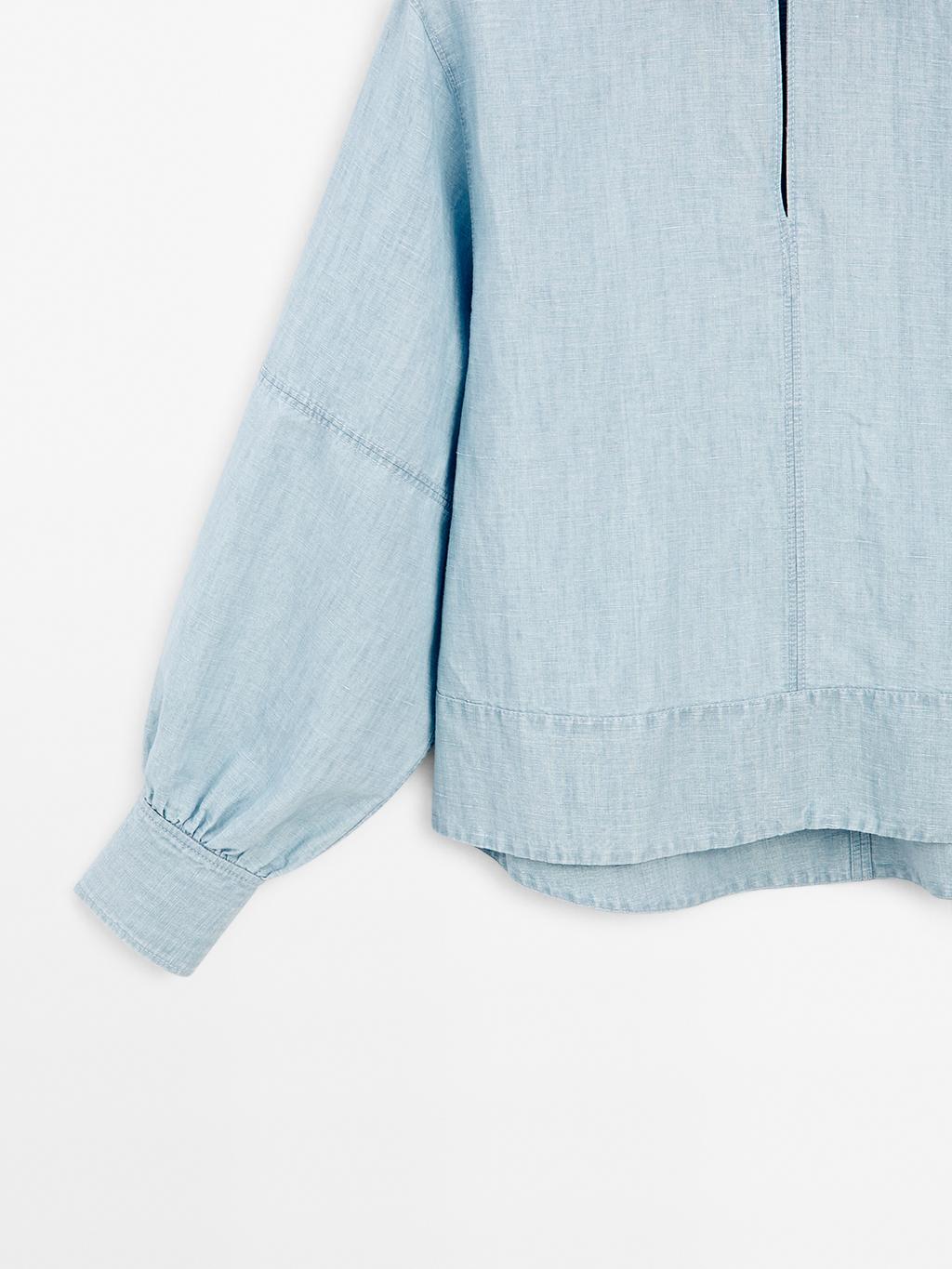 Oversize denim blouse with puff sleeves