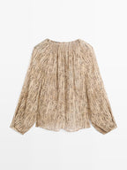 Semi-sheer draped blouse