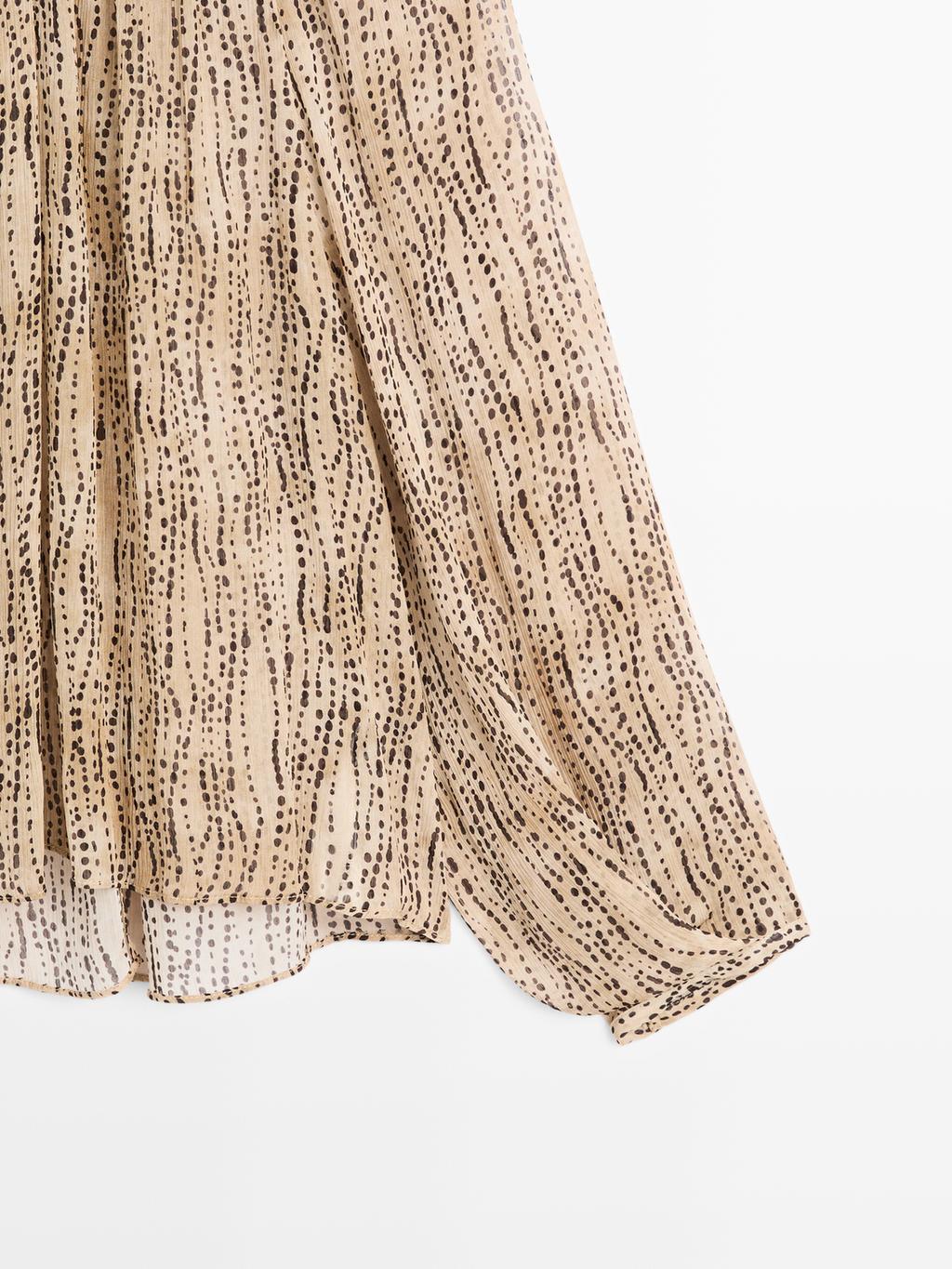 Semi-sheer draped blouse