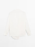 Blouse with knotted neckline and brooch detail