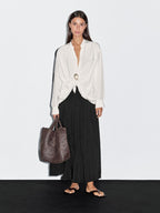 Blouse with knotted neckline and brooch detail