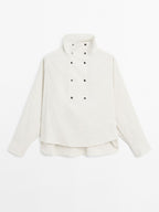 Flowing shirt with button detail on the chest