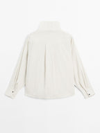 Flowing shirt with button detail on the chest