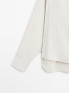 Flowing shirt with button detail on the chest