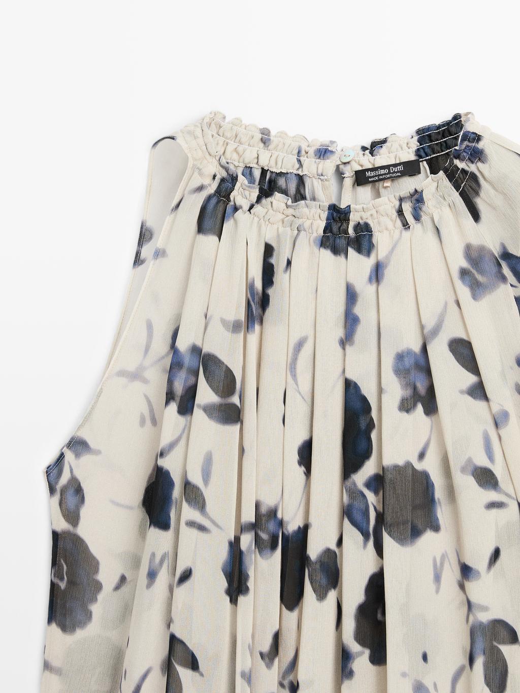 Asymmetric flowing floral print blouse