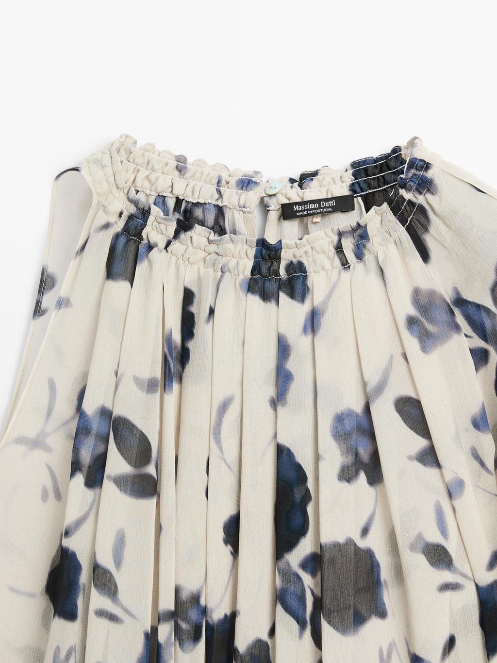 Asymmetric flowing floral print blouse