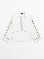 Loose-fitting blouse with contrast details