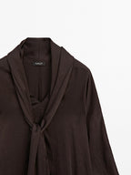 Long flowing blouse with tied neck