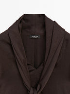 Long flowing blouse with tied neck