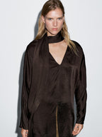 Long flowing blouse with tied neck