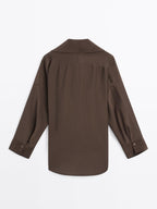 Long shirt with brooch detail