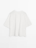 Short cape with seam details