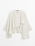 Short flowing cape with sleeve detail