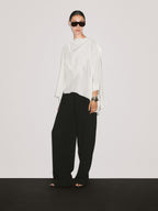 Short flowing cape with sleeve detail