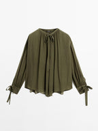 Cape blouse with ties