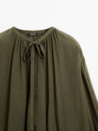Cape blouse with ties