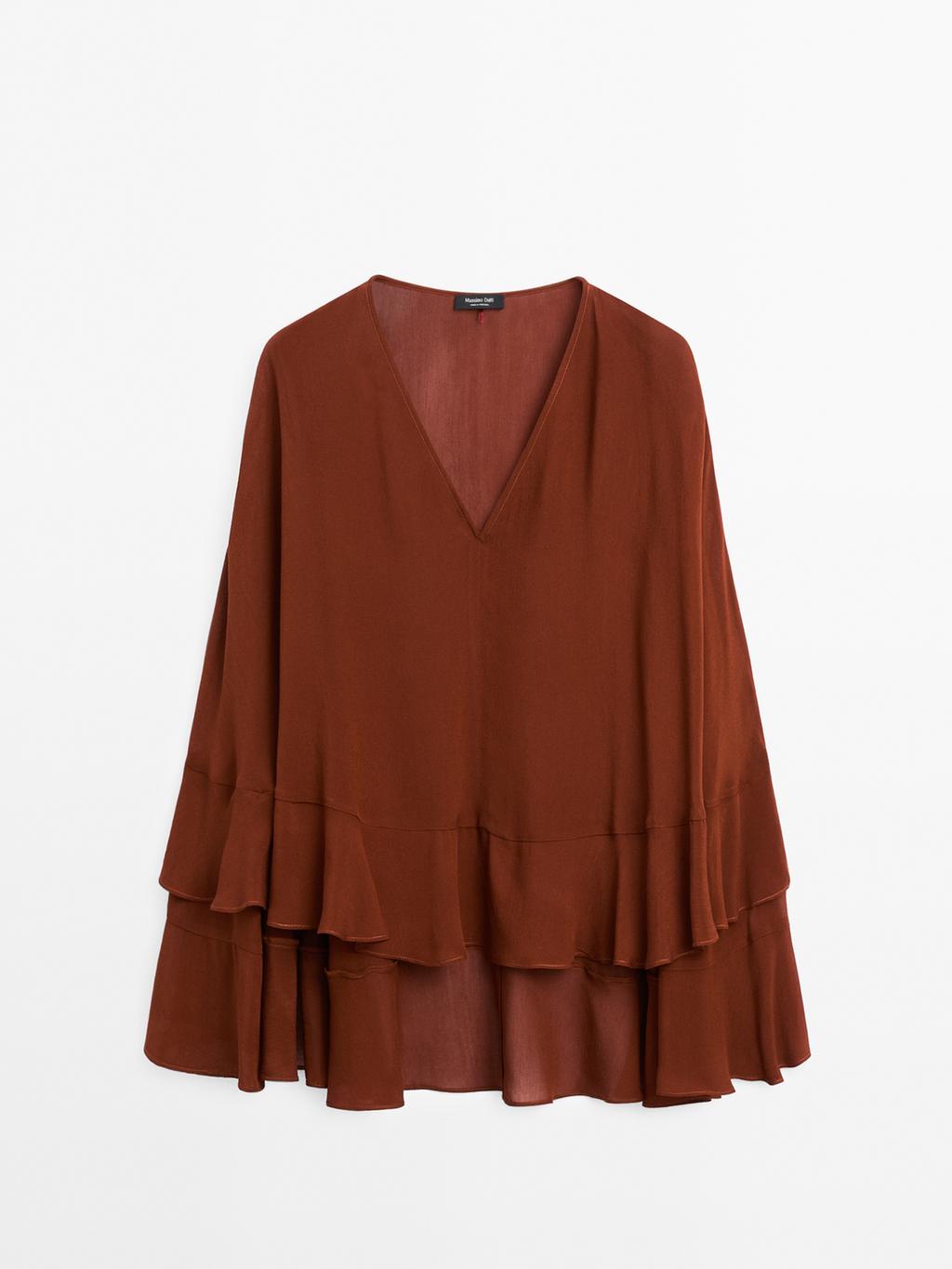 Cape-style blouse with ruffles