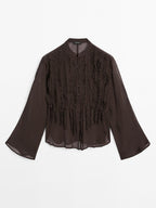 Flowing bib-front shirt with ruffles